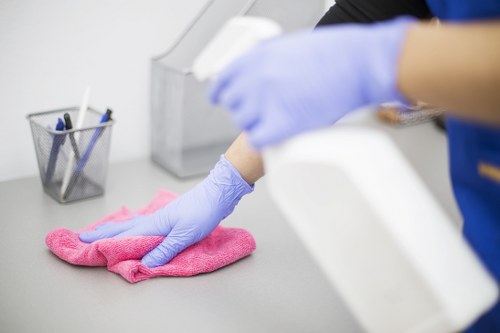 Cleaner treating a stained mattress with specialist equipment