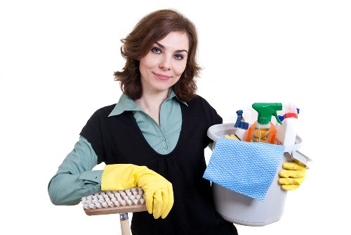 Local cleaner treating a fresh spill on upholstery in Putney